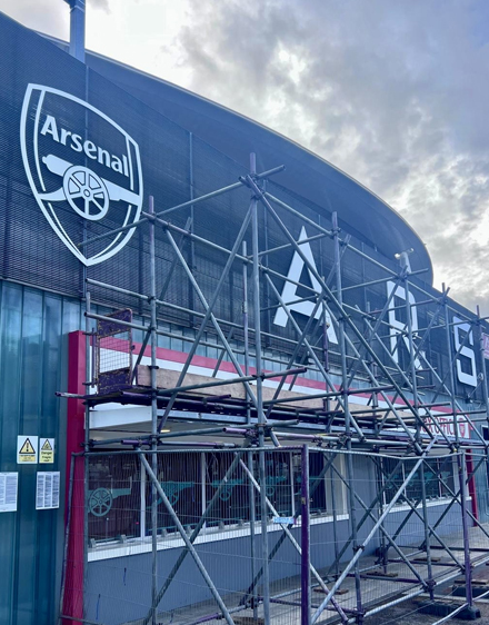 Armstrong Scaffolding commercial scaffolding installation at Arsenal's Emirates Stadium in London with safety netting and access platforms