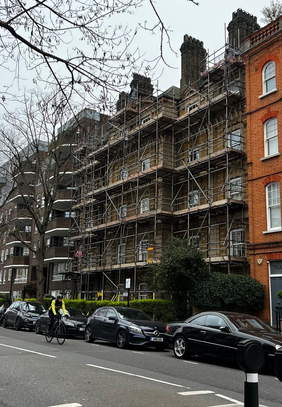 Armstrong Scaffolding full elevation access scaffold rising to the chimney stacks for a painting contract on a residential street in Chelsea